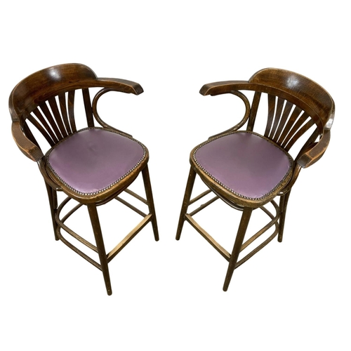 784 - A pair of vintage Bentwood high stools with vinyl seats. 95cm