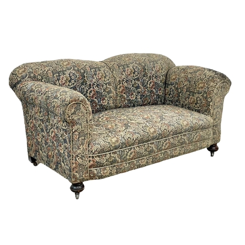 786 - A Victorian drop down club sofa. Circa 1890-1900. 160 x 82 x 78cm