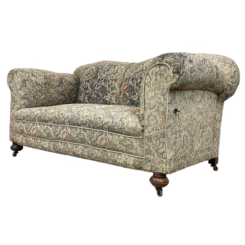 786 - A Victorian drop down club sofa. Circa 1890-1900. 160 x 82 x 78cm