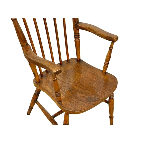 794A - A Victorian elm and beech Country House armchair.