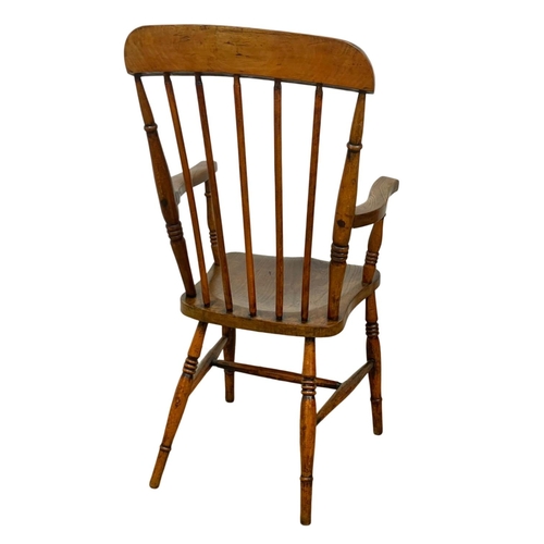 794A - A Victorian elm and beech Country House armchair.