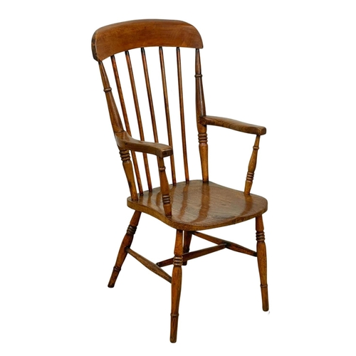 794A - A Victorian elm and beech Country House armchair.