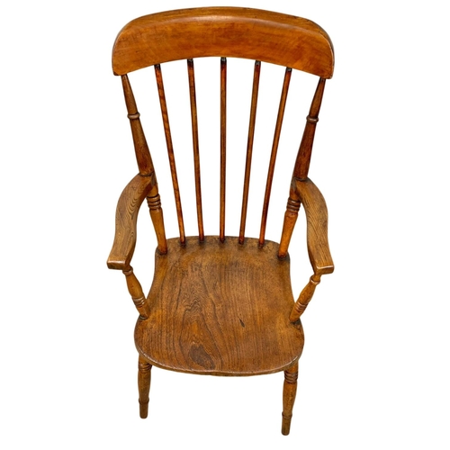 794A - A Victorian elm and beech Country House armchair.