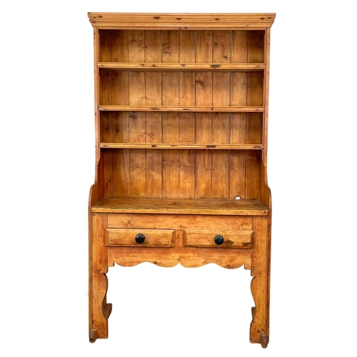 797 - A late Georgian Irish pine settle dresser. Circa 1830-1840.