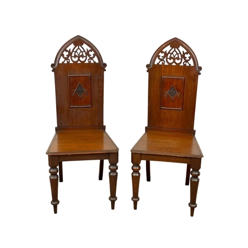 800 - A pair of large Victorian walnut high back Masonic Lodge hall chairs.