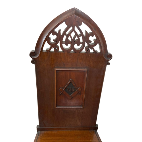 800 - A pair of large Victorian walnut high back Masonic Lodge hall chairs.