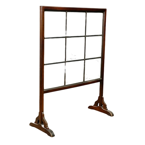 804 - A large early 20th century mahogany screen with bevelled glass panels. Circa 1900-1920. 91 x 39 x 12... 