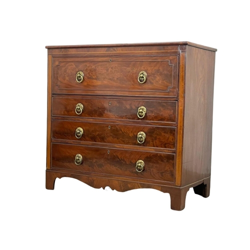 805 - A George IV inlaid mahogany secretaire chest of drawers, with brass drop ring handles and on bracket... 