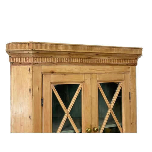 806 - A late Georgian pine corner cabinet. 101 x 54 x 184cm