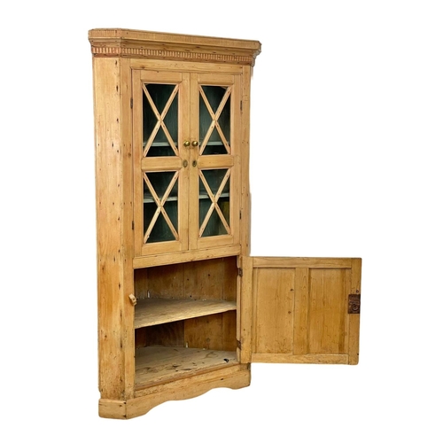 806 - A late Georgian pine corner cabinet. 101 x 54 x 184cm