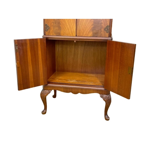 807 - A vintage Georgian style walnut cocktail cabinet. 74 x 49 x 147cm