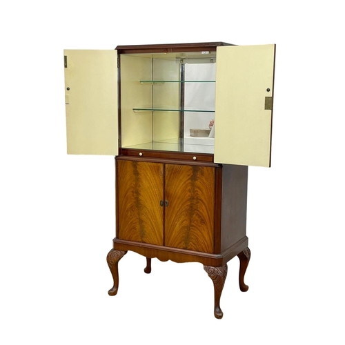 807 - A vintage Georgian style walnut cocktail cabinet. 74 x 49 x 147cm