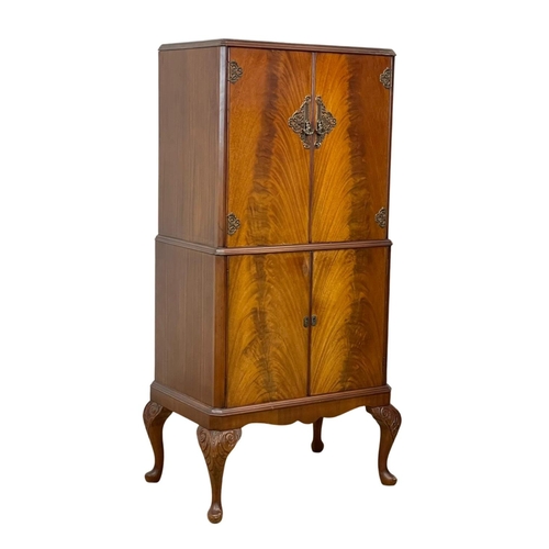 807 - A vintage Georgian style walnut cocktail cabinet. 74 x 49 x 147cm