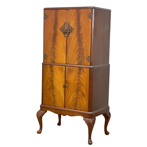 807 - A vintage Georgian style walnut cocktail cabinet. 74 x 49 x 147cm