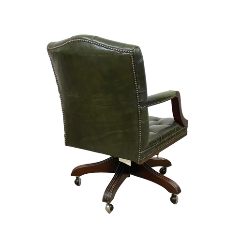 815 - A Gainsborough style deep button leather swivel desk chair.