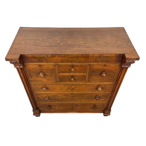 816 - A large Victorian inlaid mahogany chest of drawers. 126 x 57.5 x 134cm