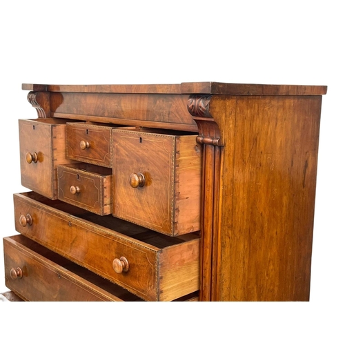 816 - A large Victorian inlaid mahogany chest of drawers. 126 x 57.5 x 134cm