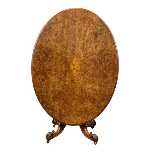 818 - A Victorian Burr Walnut tilt top breakfast / dining table, with carved base. Circa 1860-1870. 147 x ... 