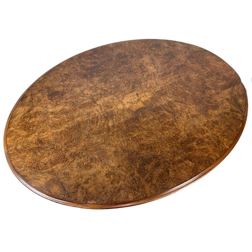 818 - A Victorian Burr Walnut tilt top breakfast / dining table, with carved base. Circa 1860-1870. 147 x ... 