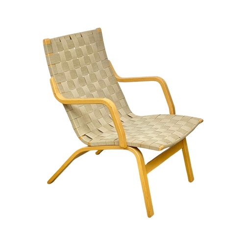 823 - A 1970’s Mid Century lounge chair, in the manner of Bruno Mathsson.