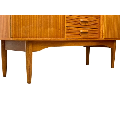 826 - A Mid Century teak sideboard. 145.5 x 46 x 89cm