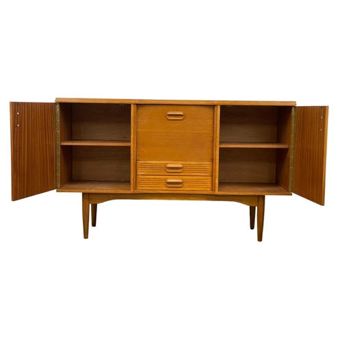 826 - A Mid Century teak sideboard. 145.5 x 46 x 89cm