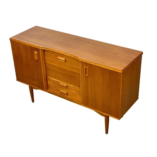 826 - A Mid Century teak sideboard. 145.5 x 46 x 89cm