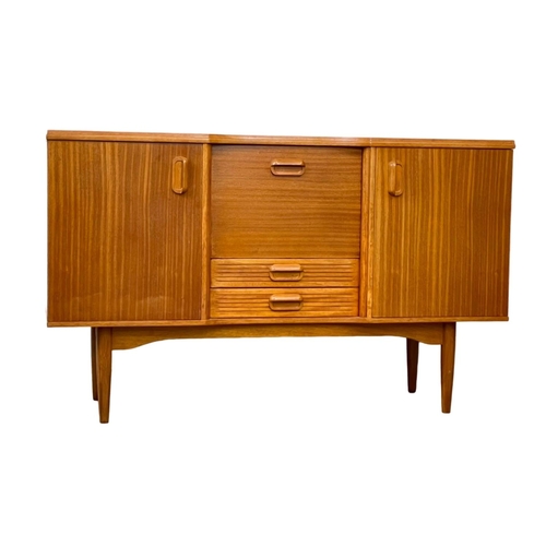 826 - A Mid Century teak sideboard. 145.5 x 46 x 89cm