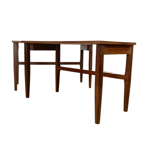 829 - A pair of Mid Century teak and afromosia end tables. 60.5 x 30.5 x 35.5cm