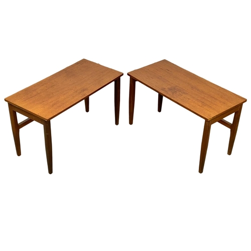 829 - A pair of Mid Century teak and afromosia end tables. 60.5 x 30.5 x 35.5cm