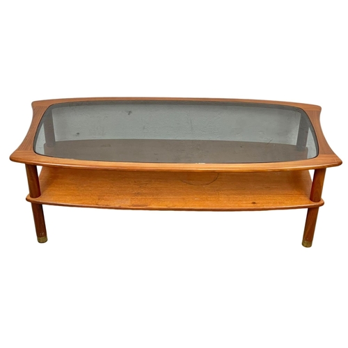 832 - A G-Plan Mid Century teak 2 tier coffee table, with smoked glass top. E.Gomme. 1960’s. 123 x 56 x 43... 