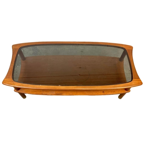 832 - A G-Plan Mid Century teak 2 tier coffee table, with smoked glass top. E.Gomme. 1960’s. 123 x 56 x 43... 