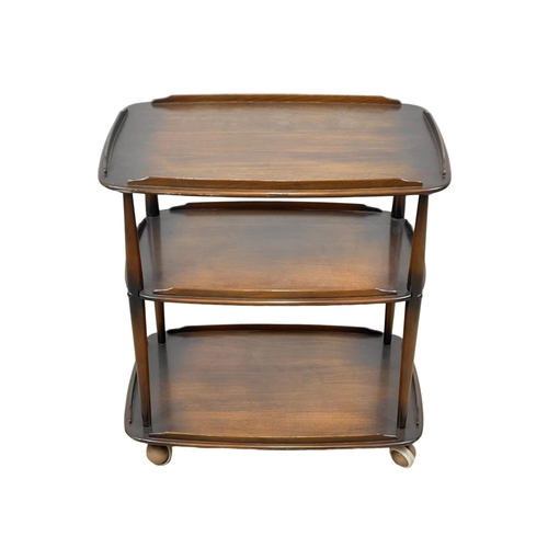 833 - An Ercol Mid Century elm 3 tier serving trolley. 71.5 x 46.5 x 77cm