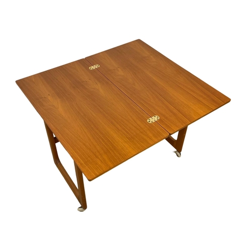 835 - A McIntosh “Triform” Mid Century teak turnover coffee table, with 2 nesting tables.