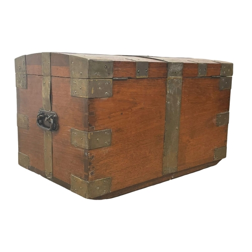 838 - A Victorian brass bound teak trunk. 66 x 40 x 40cm