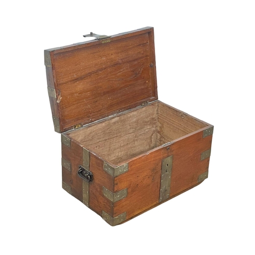 838 - A Victorian brass bound teak trunk. 66 x 40 x 40cm