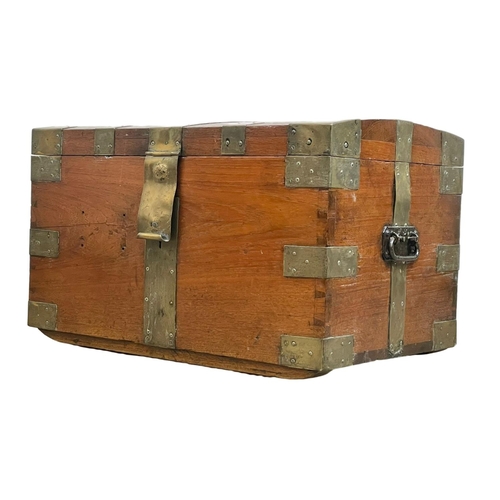 838 - A Victorian brass bound teak trunk. 66 x 40 x 40cm