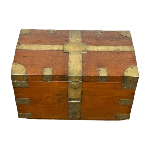 838 - A Victorian brass bound teak trunk. 66 x 40 x 40cm