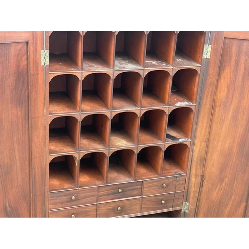 844 - A George III mahogany wall hanging 2 door pigeonhole cupboard, with interior shelves. Circa 1800. 66... 