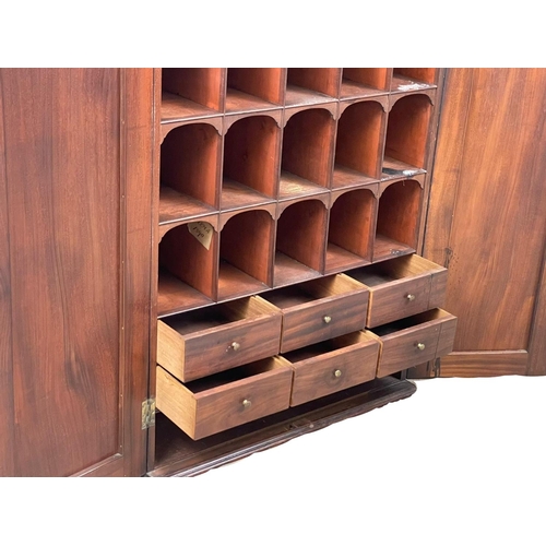 844 - A George III mahogany wall hanging 2 door pigeonhole cupboard, with interior shelves. Circa 1800. 66... 