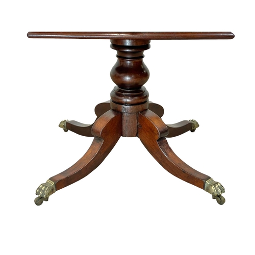 845 - A George IV mahogany teapoy, on brass Lion Paw feet. Circa 1820. 50 x 35 x 65cm