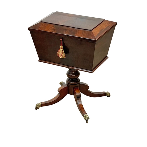 845 - A George IV mahogany teapoy, on brass Lion Paw feet. Circa 1820. 50 x 35 x 65cm