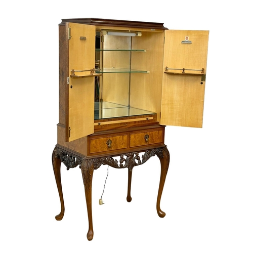 852 - A vintage Georgian style Burr Walnut cocktail cabinet, with 2 shelves. 77 x 49 x 153cm