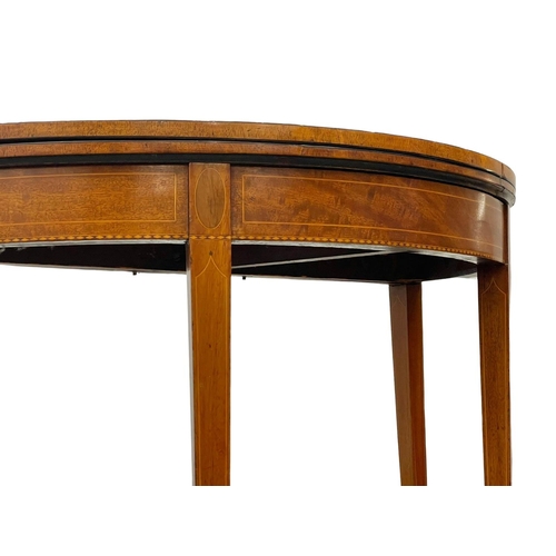 862 - A George III inlaid mahogany turnover tea table. Circa 1780. 91 x 45 x 73cm