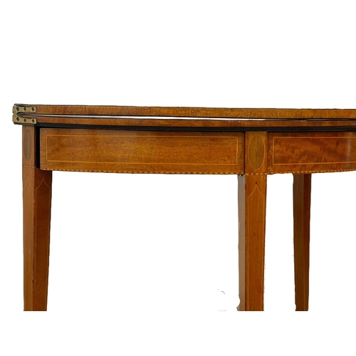 862 - A George III inlaid mahogany turnover tea table. Circa 1780. 91 x 45 x 73cm