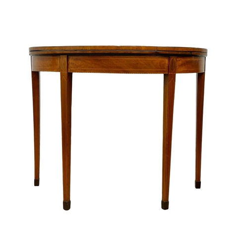 862 - A George III inlaid mahogany turnover tea table. Circa 1780. 91 x 45 x 73cm