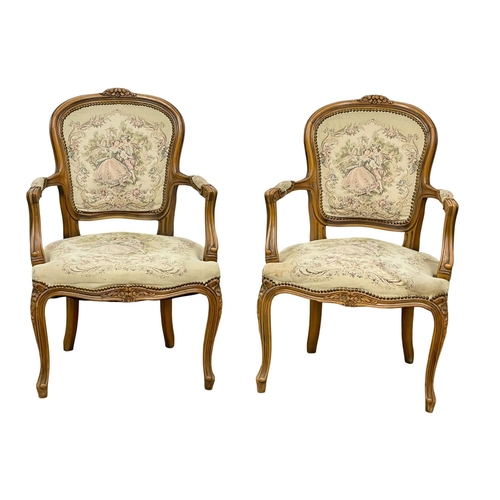 864 - A pair of French 18th century style armchairs.