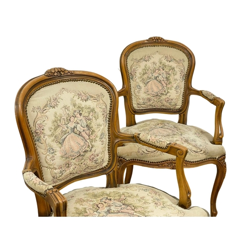 864 - A pair of French 18th century style armchairs.