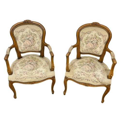 864 - A pair of French 18th century style armchairs.