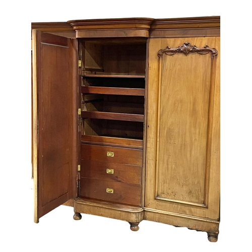 869 - A very large Victorian mahogany triple door wardrobe. With interior drawers.  250 x 75 x 215cm